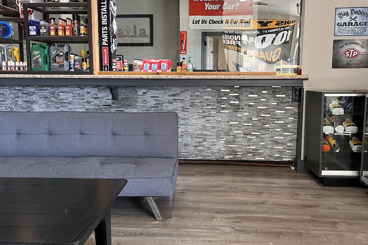 The clean customer waiting room and cashier counter at American Tire Lube & Automotive